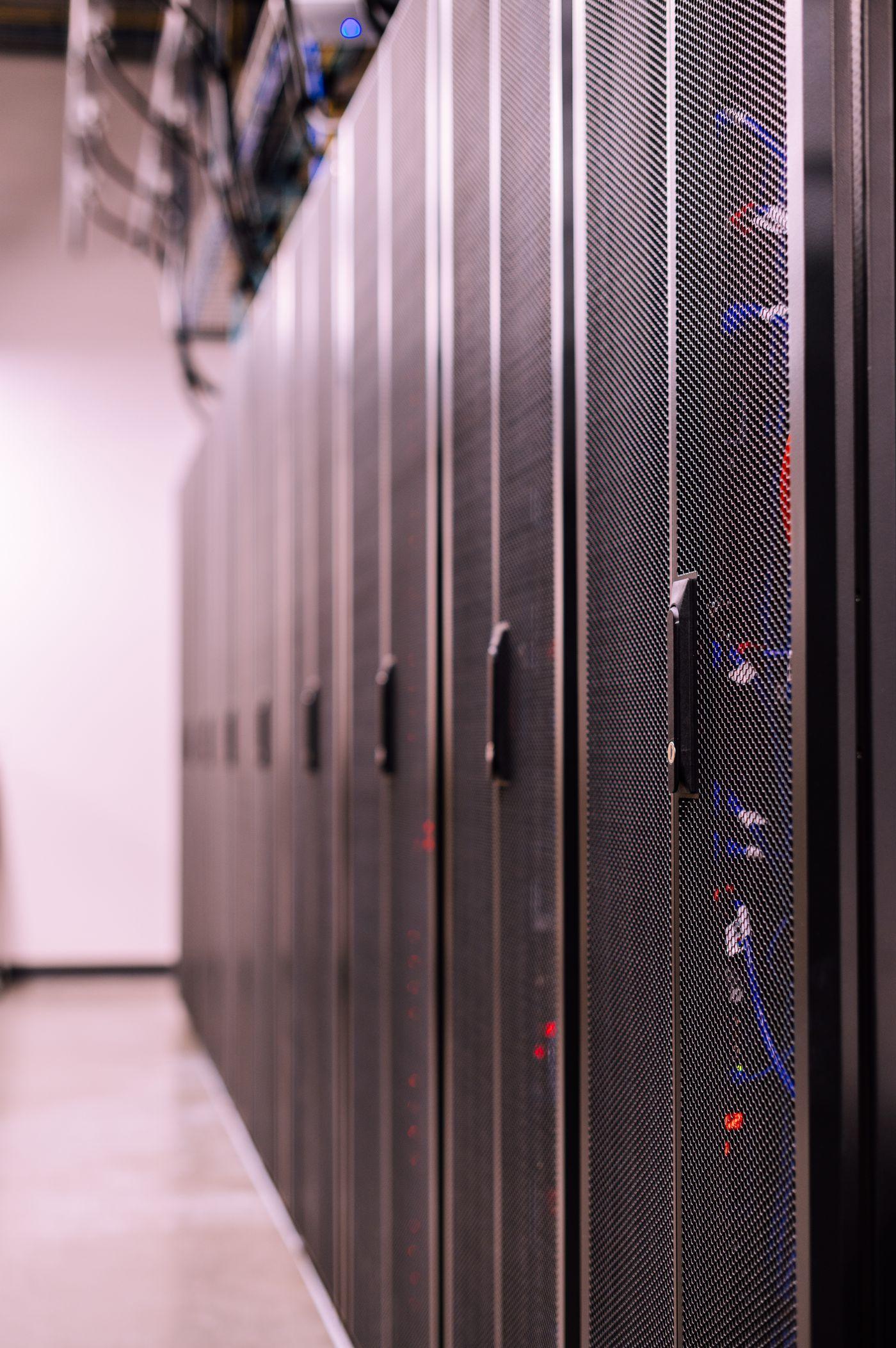 A row of server cabinets in a data centre aisle